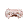 Pale pink knotted bow headband with heart pattern