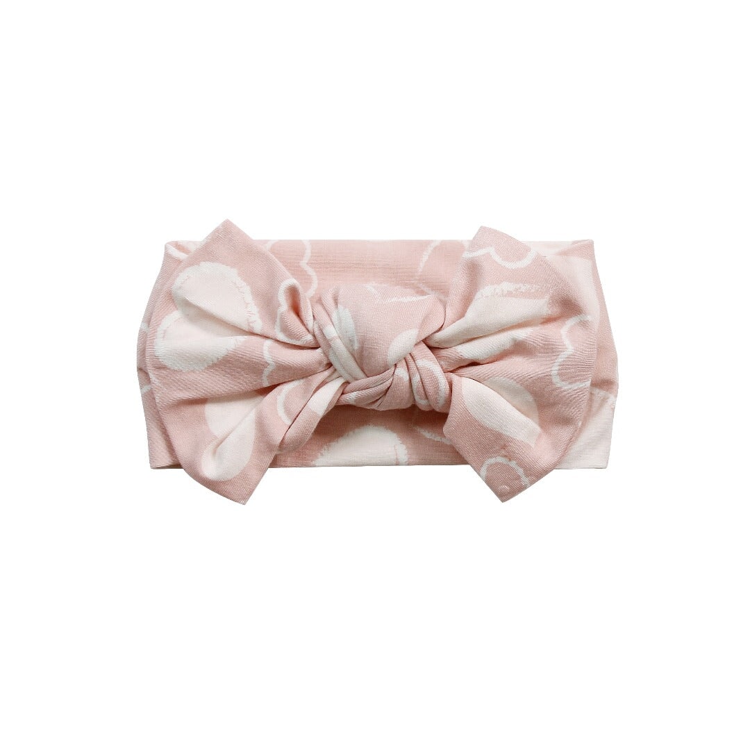 Pale pink knotted bow headband with heart pattern