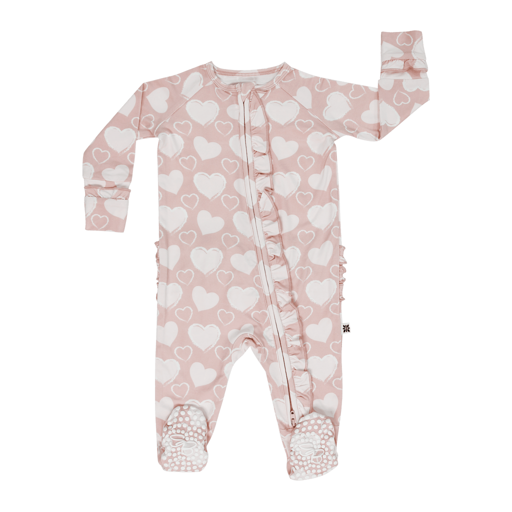 Girl ruffle footie in light pink with white hearts, zip-front, long sleeves, footed