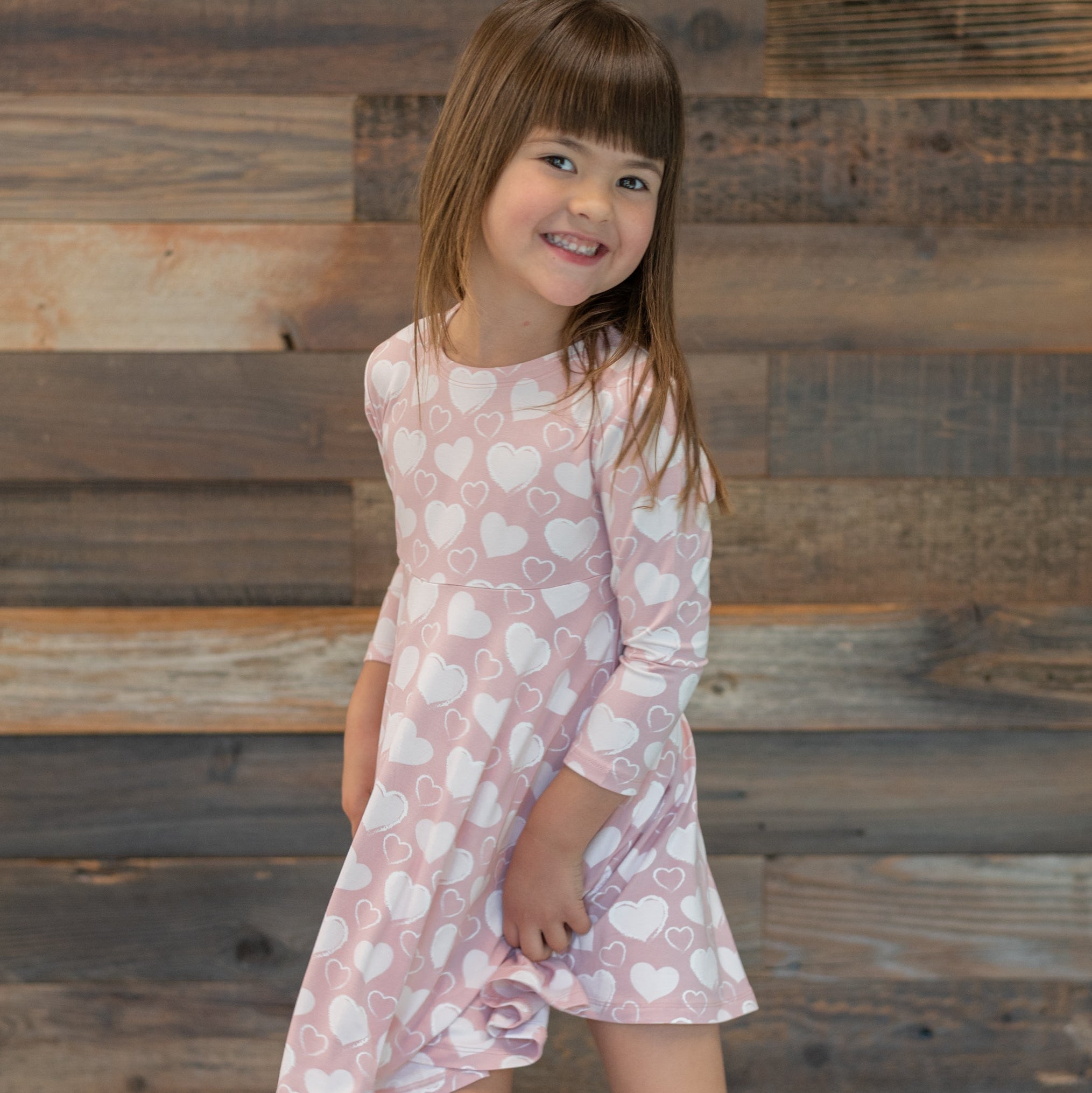Girl swirly dress, pink heart print, long sleeves, flared hem