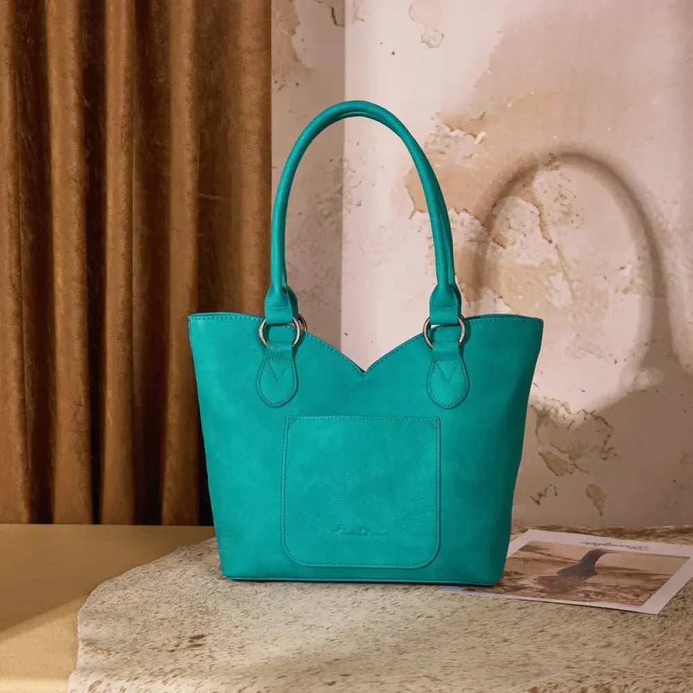 Teal turquoise tote bag with twin top handles and front pocket, structured body.