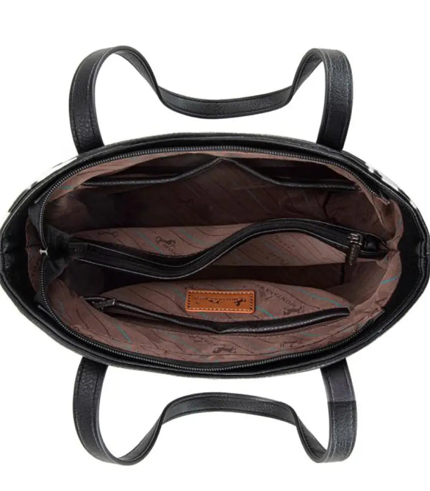 Black tote bag interior with zipper closure and branded patch inside.