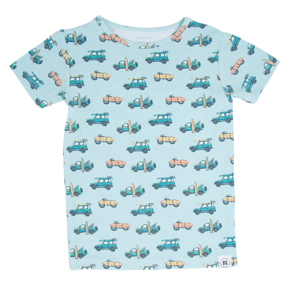 Light blue boys pajama shirt with crew neck and allover vehicle and surf print