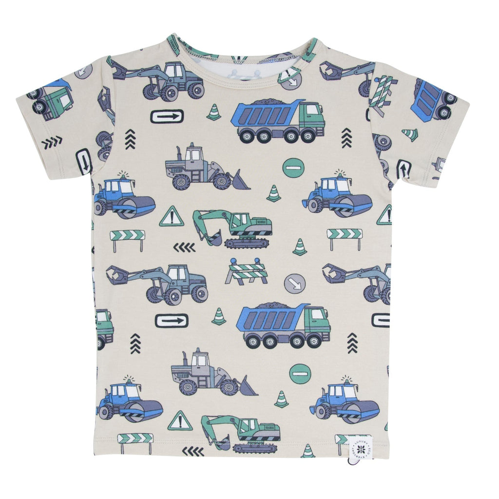 Short-sleeve kids pajama top with construction vehicle pattern, crew neck, light background