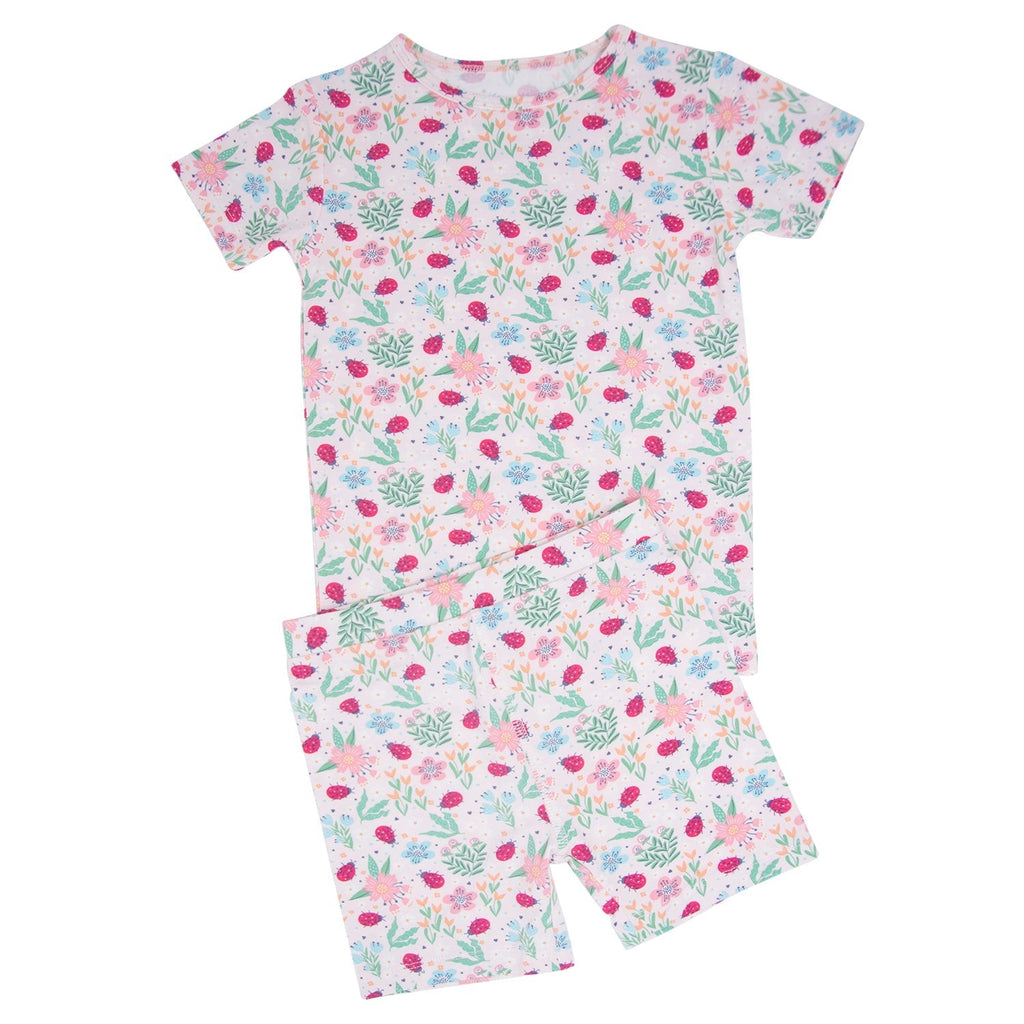 Girls summer pajama set shirt and shorts with ladybug floral print on light background