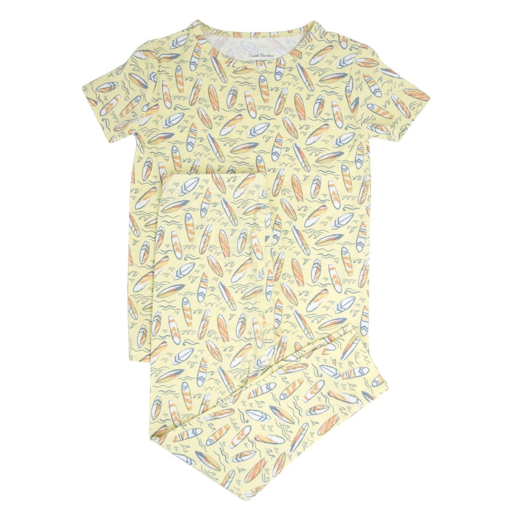 Big kid short-sleeve pajama set with surfboard print, yellow and multicolor