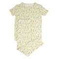 Big kid short-sleeve pajama set with surfboard print, yellow and multicolor