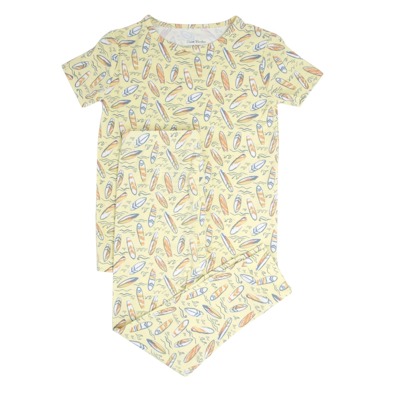 Big kid short-sleeve pajama set with surfboard print, yellow and multicolor