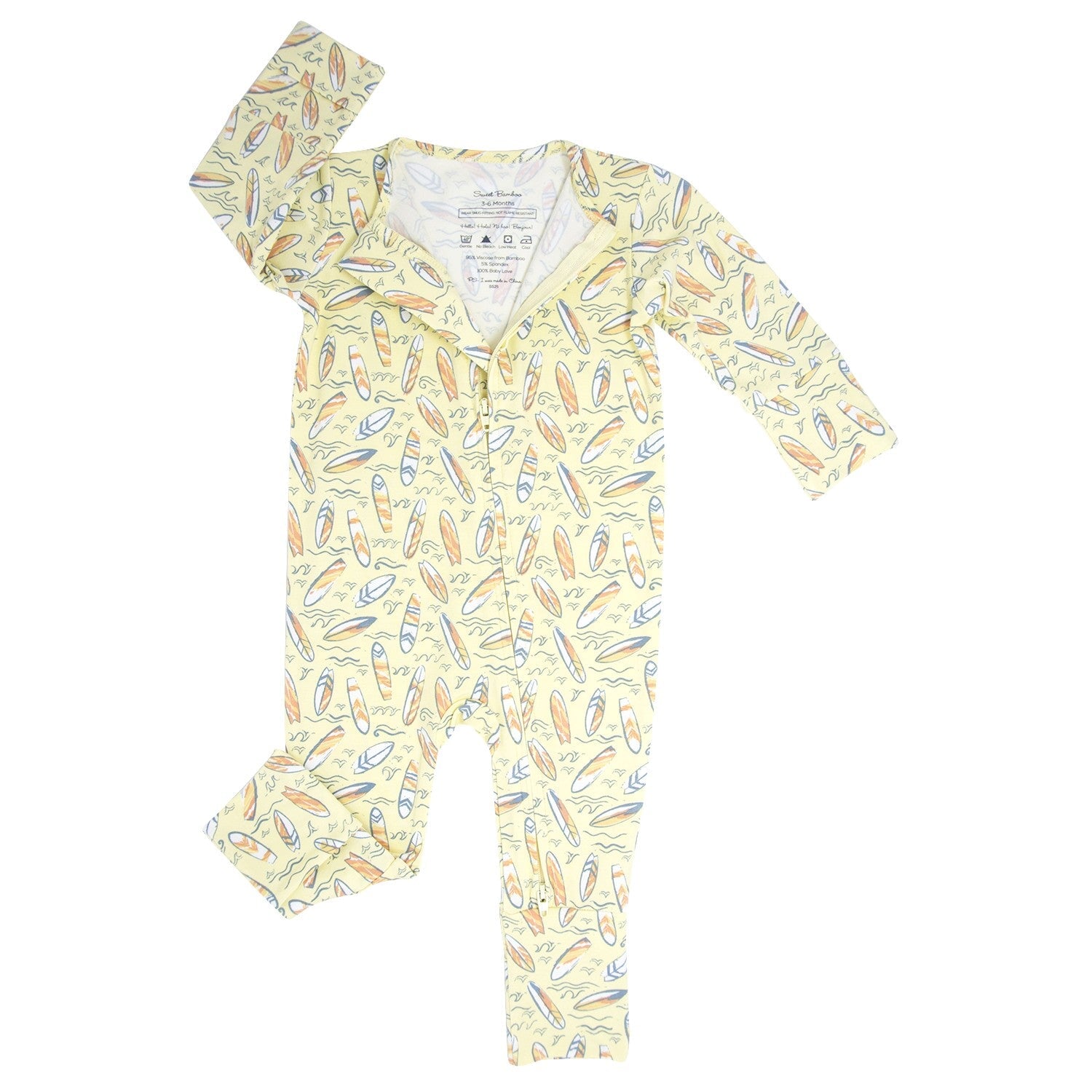 Light yellow patterned long-sleeve footed romper with V-neck opening and snaps