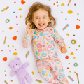Kids convertible romper on child, long sleeves, light pink dessert print