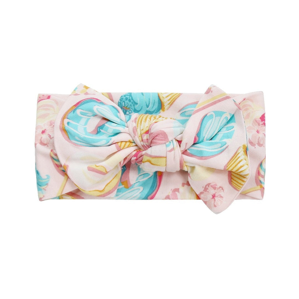 Pastel candy-print knotted bow headband with large bow and center knot