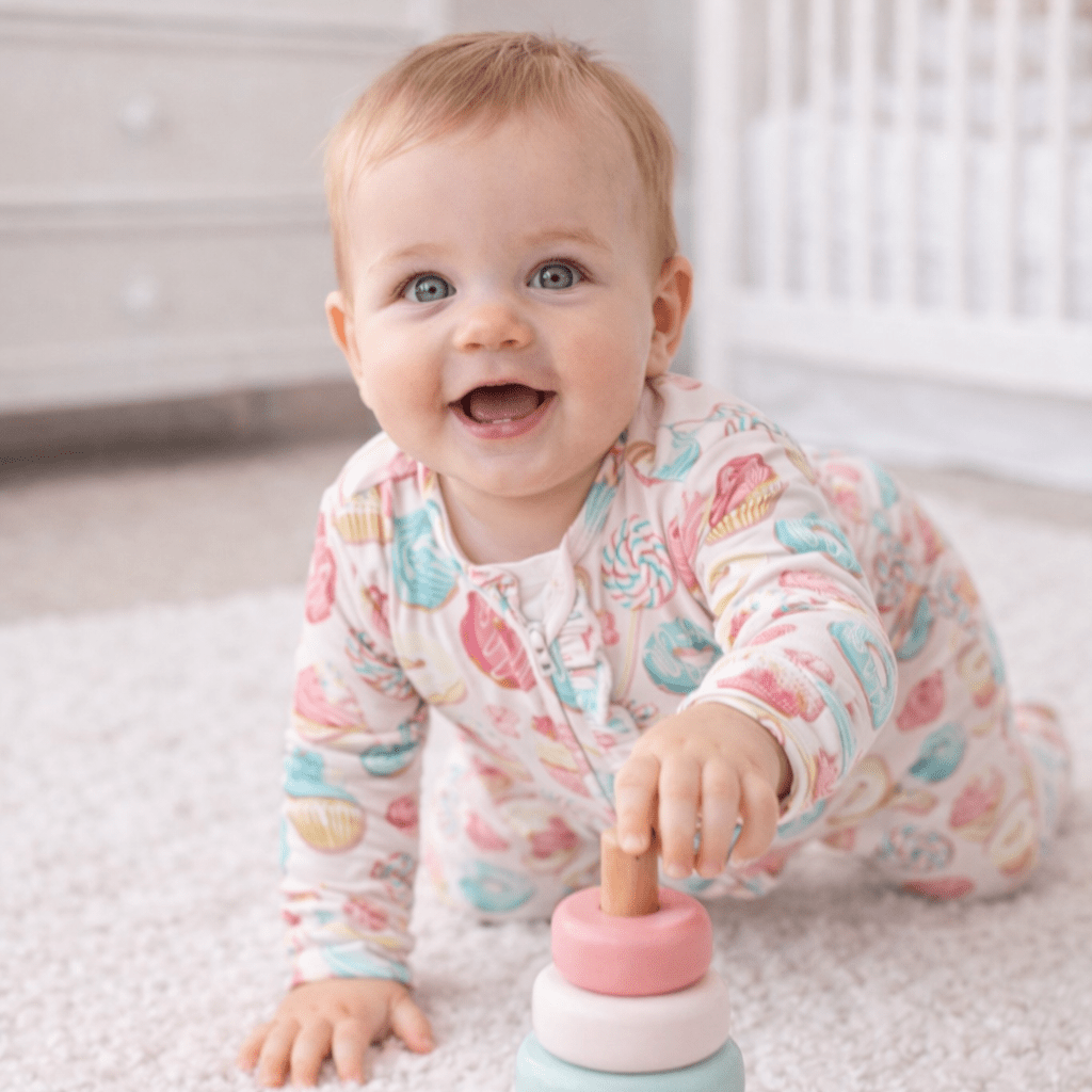 Baby footie pajamas with pastel sweet treats print, ruffled collar, long sleeves