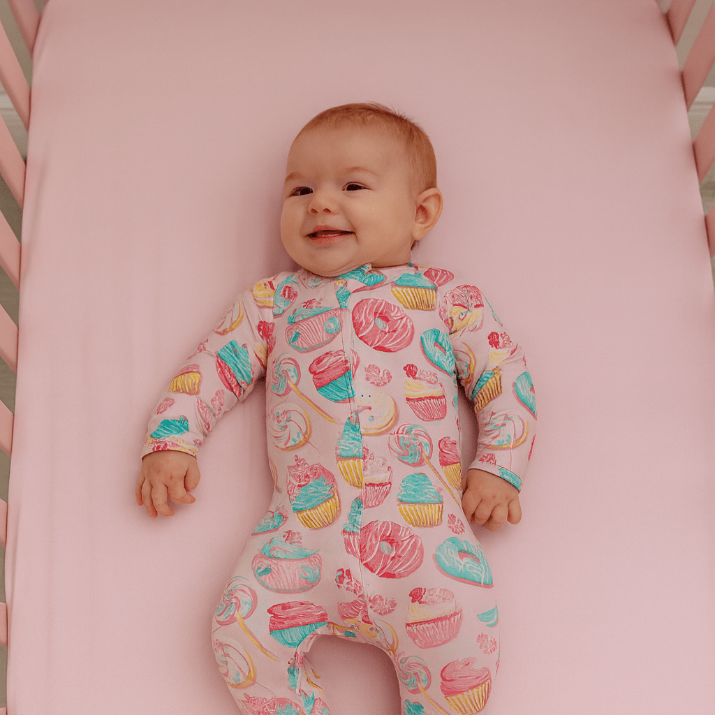 Baby girl footie pajama in pastel cupcake print, long sleeves and full-length legs