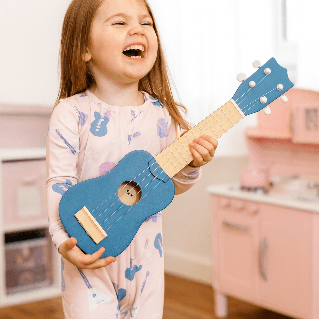 Girls convertible romper, light pink with allover guitar print and long sleeves
