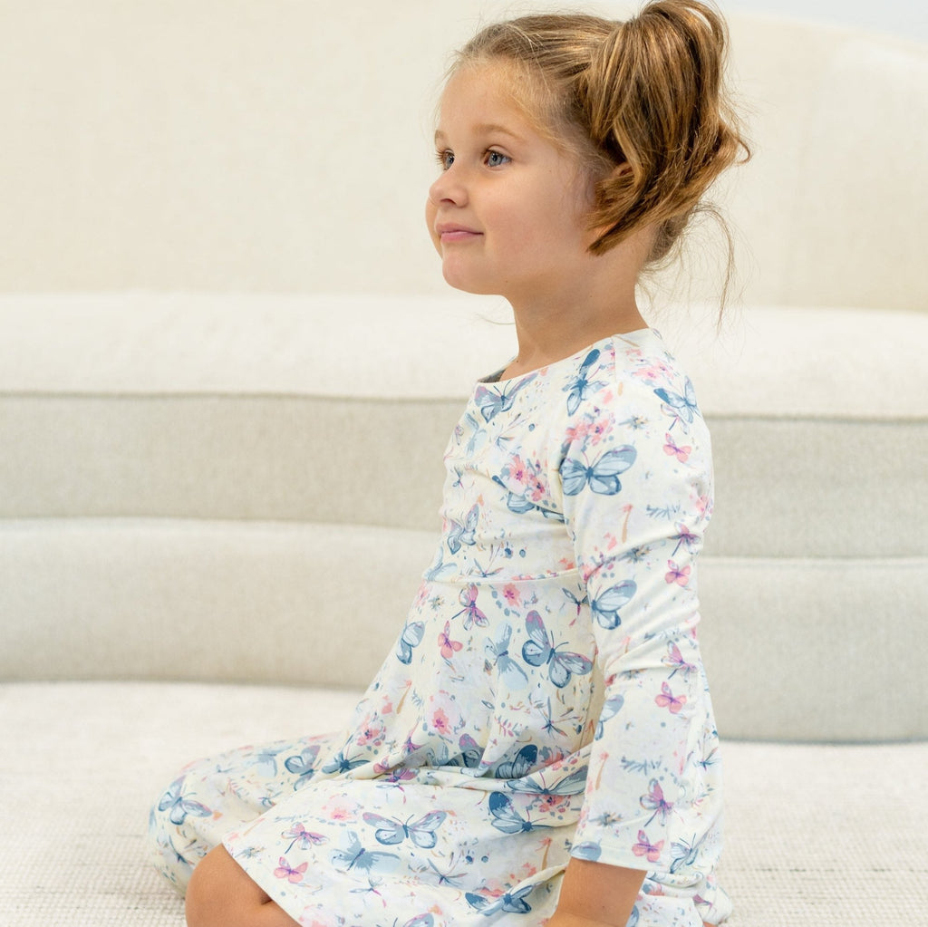 Girls watercolor butterfly dress with long puff sleeves and twirl hem, light cream