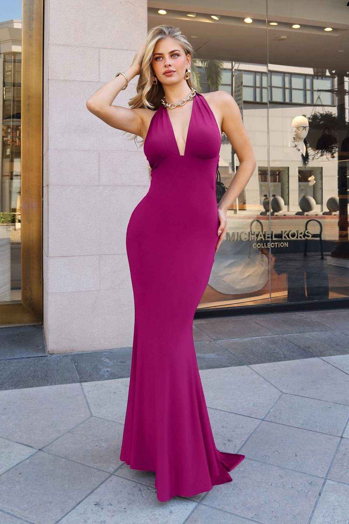 Purple fitted halter-neck stretch gown with deep V neckline and floor-length mermaid hem