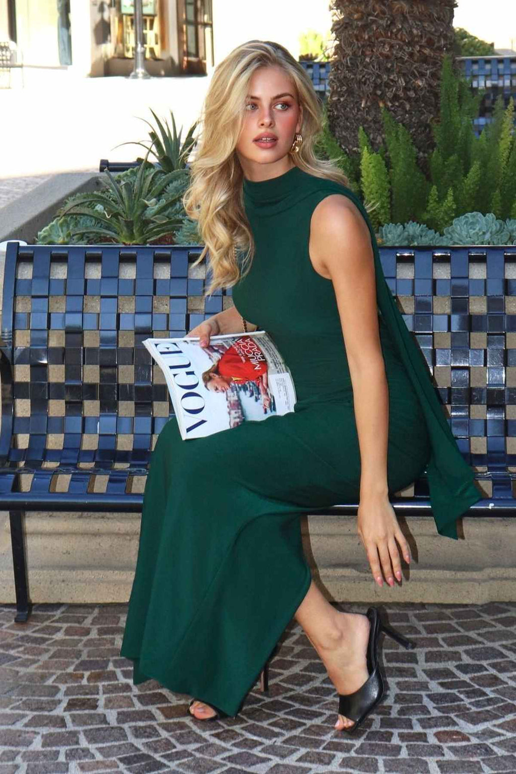 Hunter green sleeveless fitted evening dress with high neckline and side drape