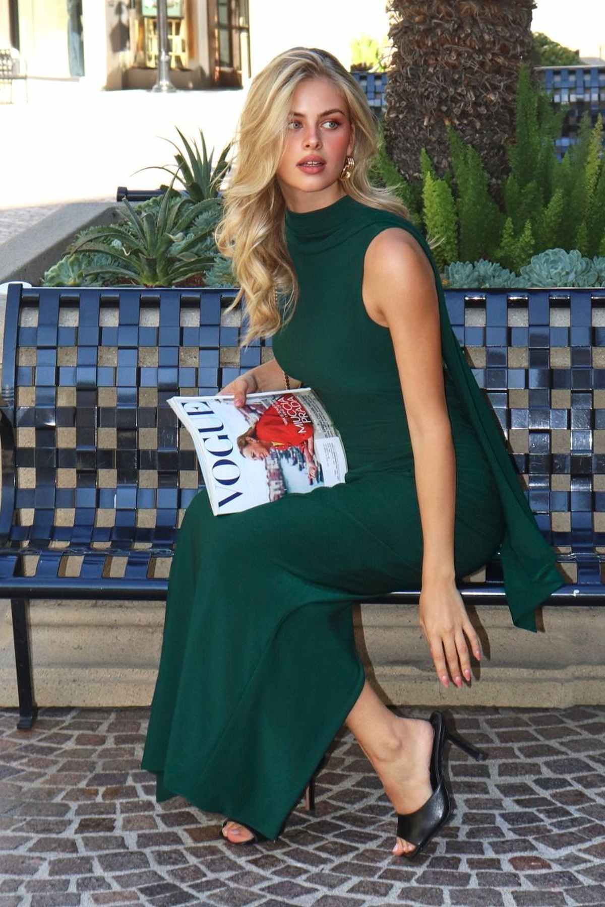 Hunter green sleeveless fitted evening dress with high neckline and side drape