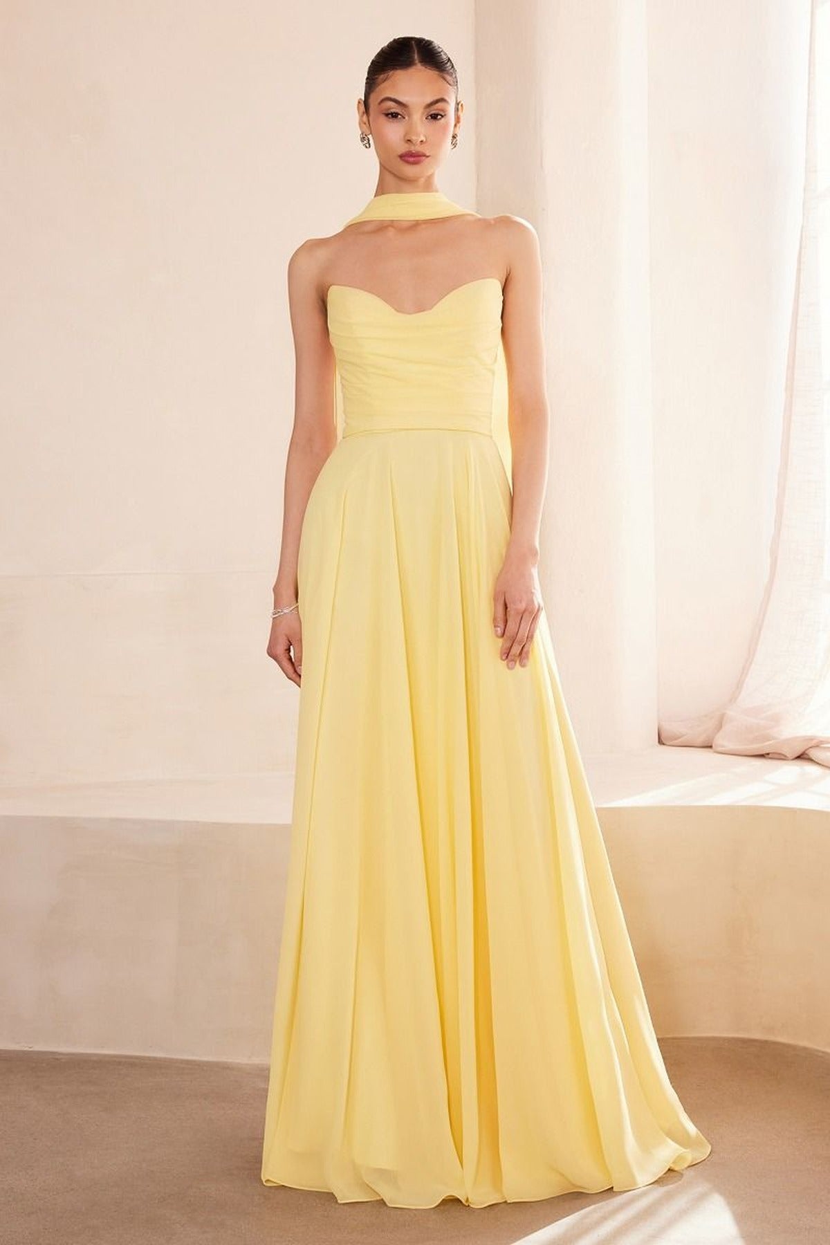 Light yellow strapless A-line bridesmaid dress with sweetheart neckline and pleated skirt