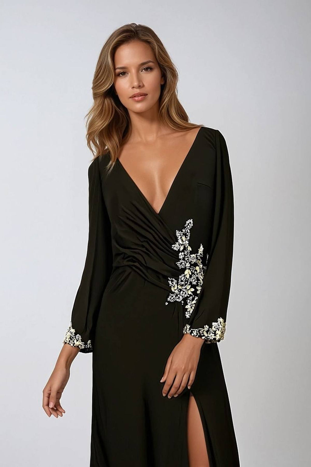 Black long-sleeve V-neck gown with floral embellishment and side leg slit
