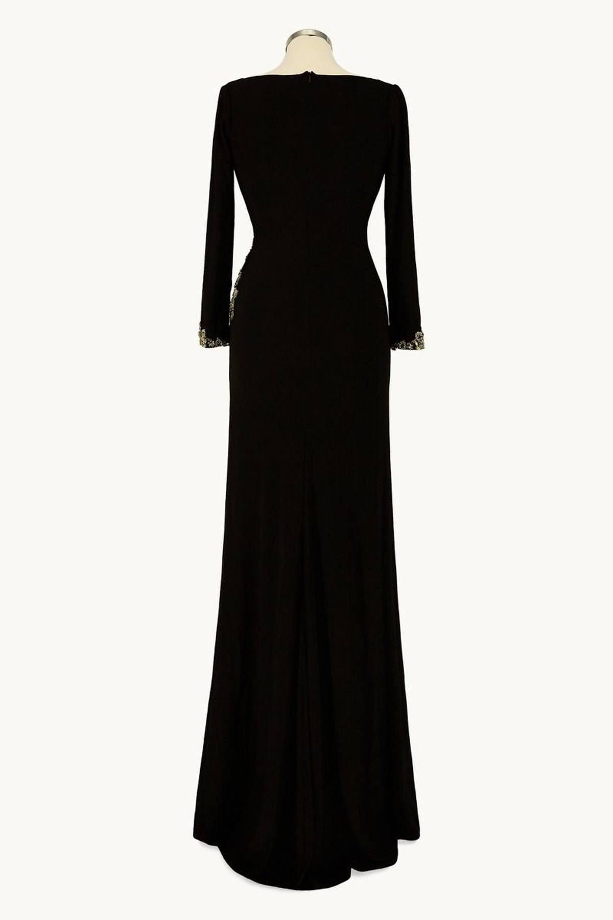 Black long-sleeve gown, back view with fitted waist and slit hem