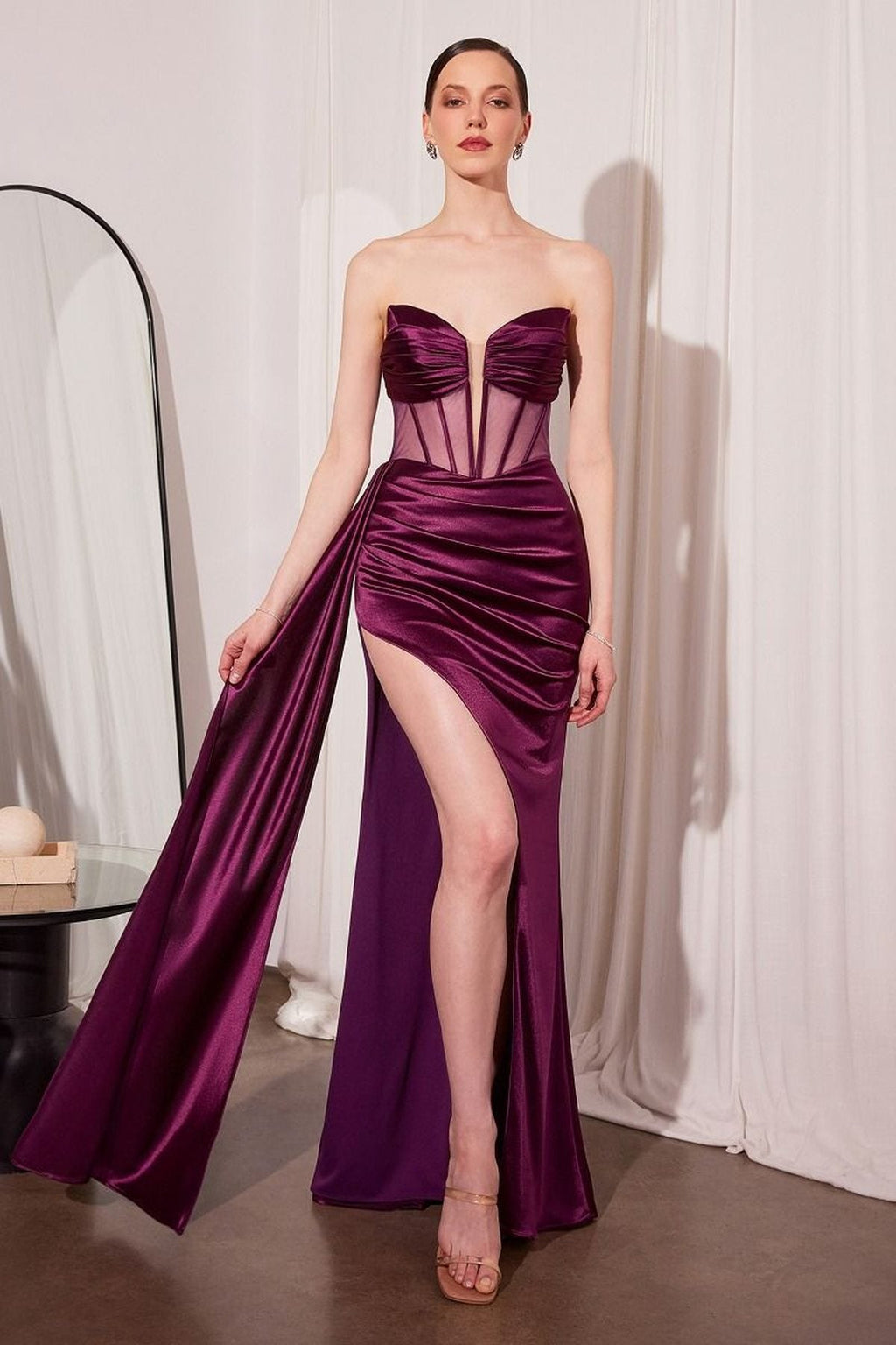 Plum strapless satin evening gown with sweetheart corset bodice and thigh-high slit