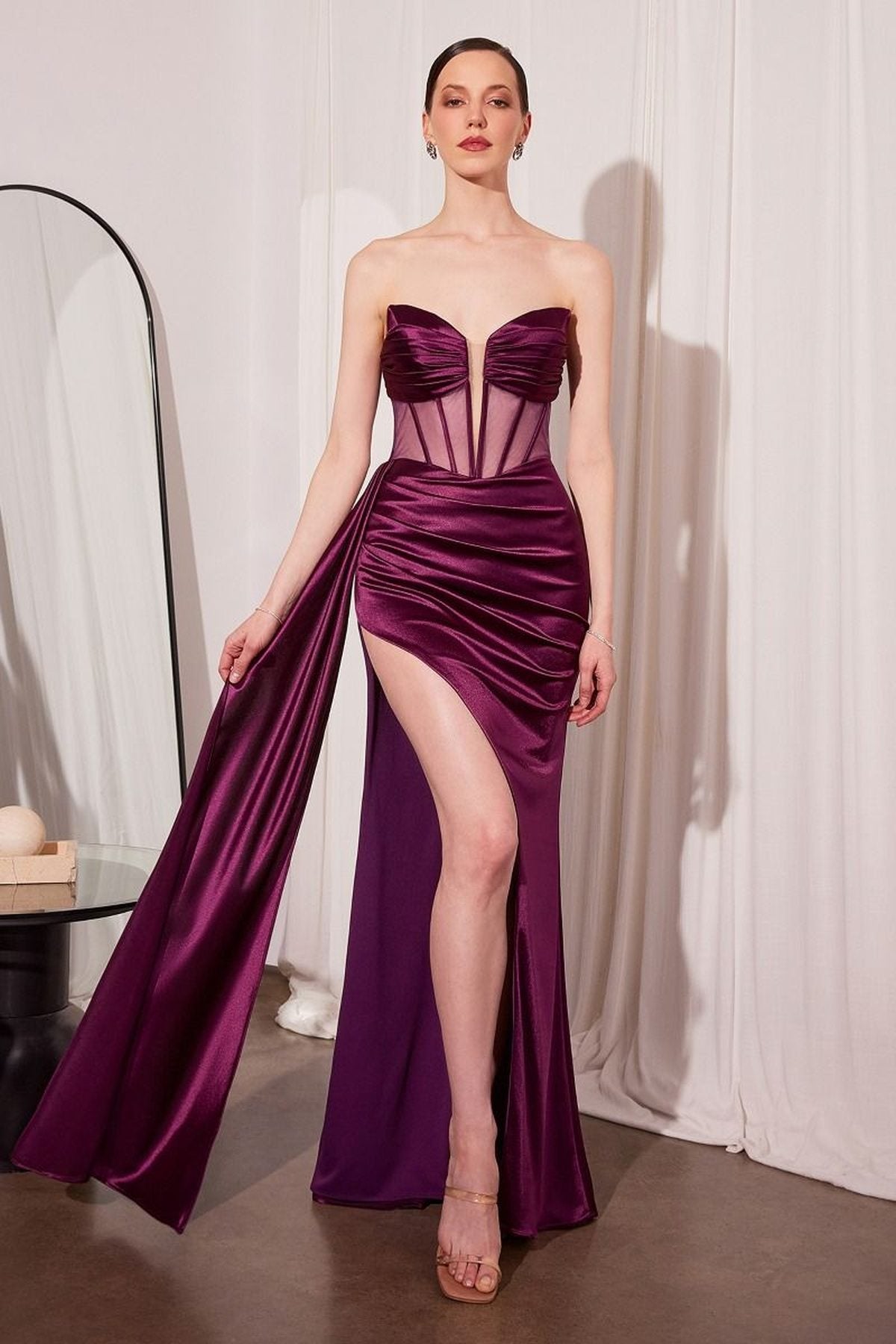 Plum strapless satin evening gown with sweetheart corset bodice and thigh-high slit