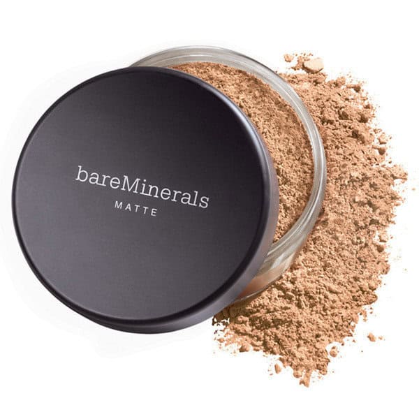 bareMinerals matte foundation compact with powder spilled beside the open container.