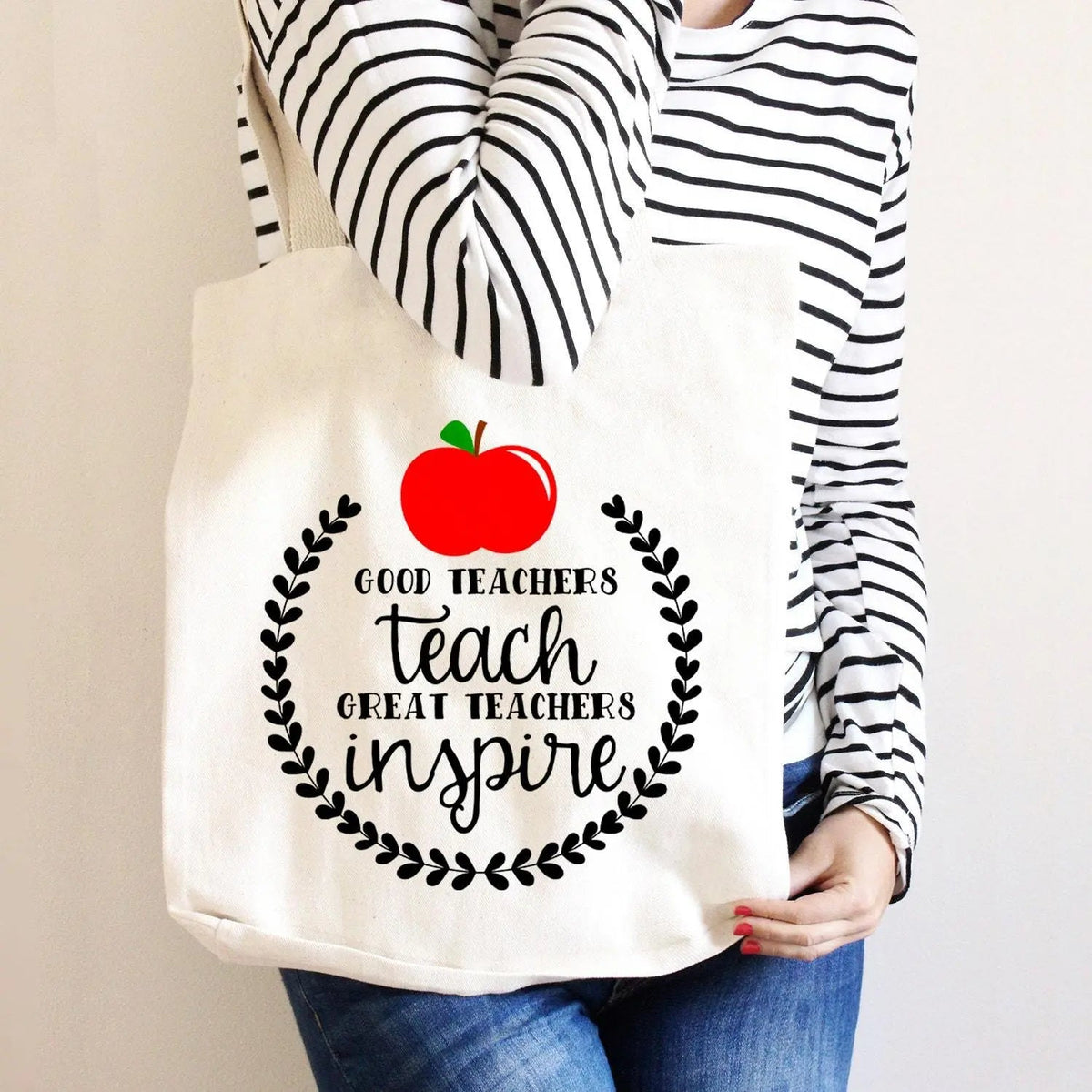 Cream canvas tote bag with apple logo and 'teach great teachers inspire' text