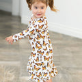 Girl's long-sleeve dress with white base and orange butterfly print, round neckline