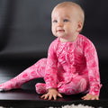Pink rose-print ruffle footie with long sleeves and gathered collar