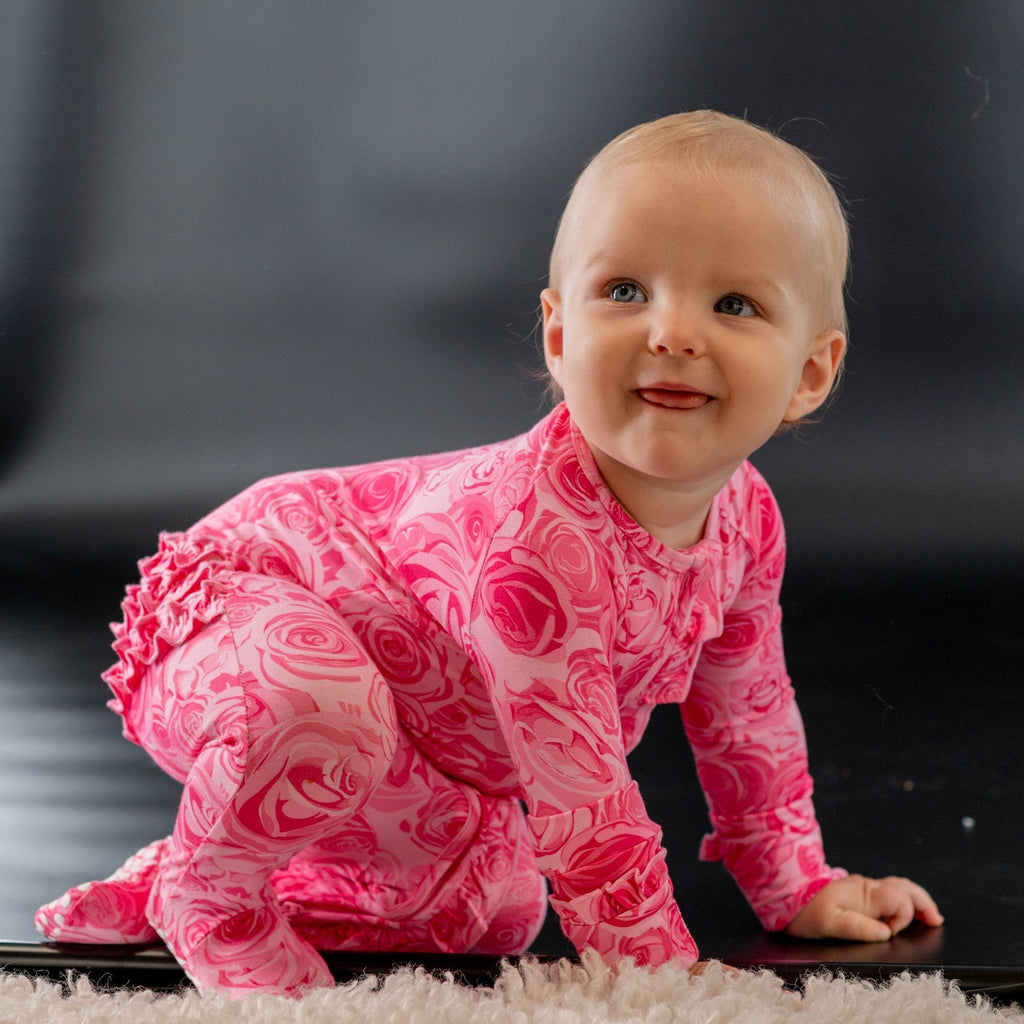 Pink rose-print ruffle footie with long sleeves and soft gathered collar