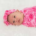Pink rose swaddle blanket with matching head wrap, soft plush texture