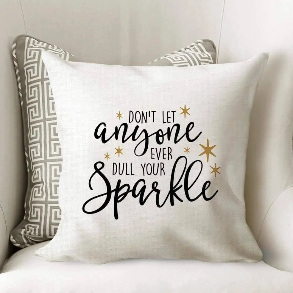 White throw pillow cover with 'Don't let anyone ever dull your sparkle' quote
