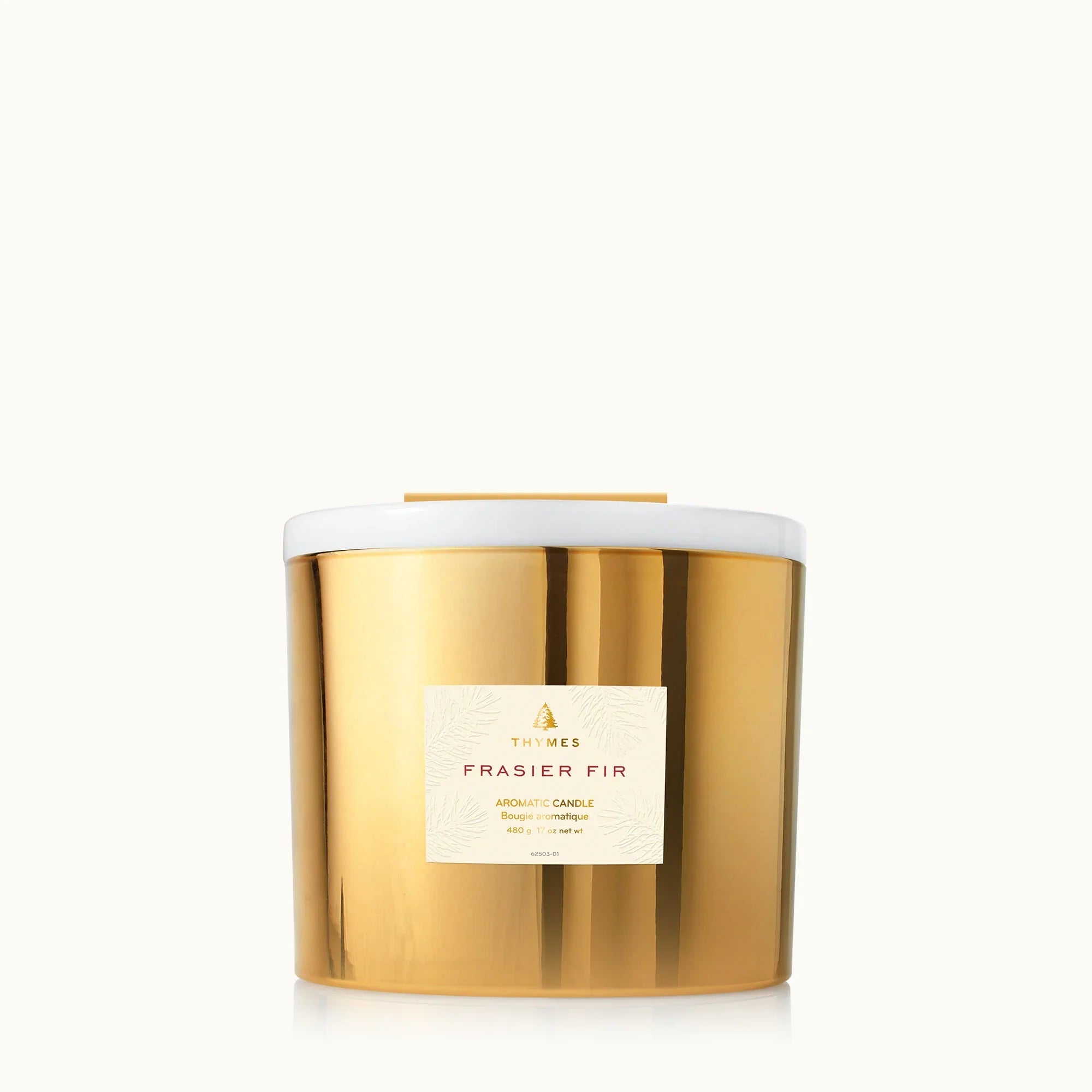 Thymes Frasier Fir 3-wick candle in gold glass jar with white lid and label