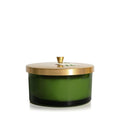Green 4-wick candle in a glass jar with a gold lid