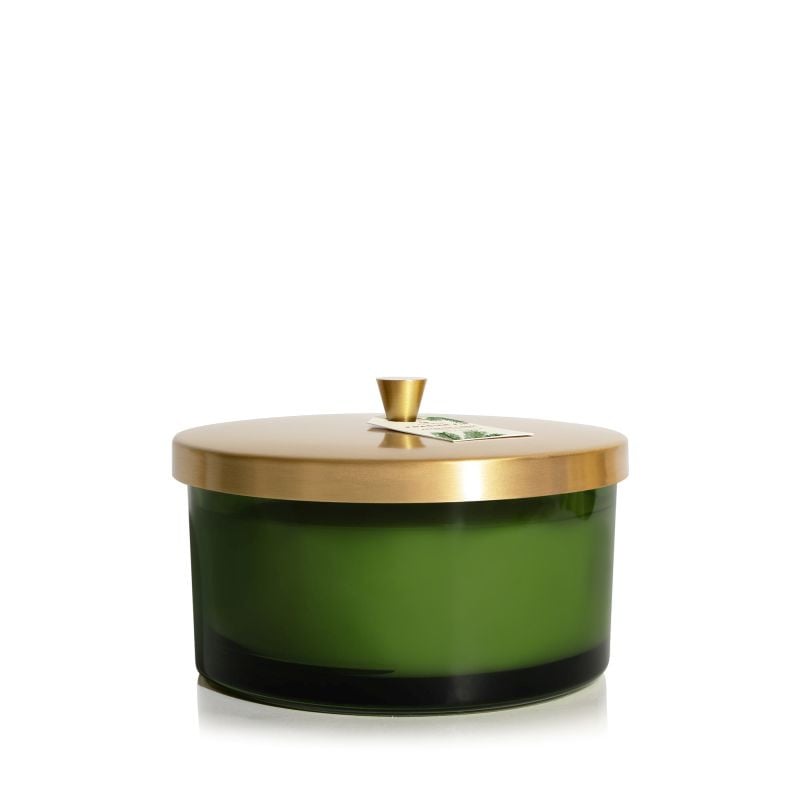 Green 4-wick candle in a glass jar with a gold lid