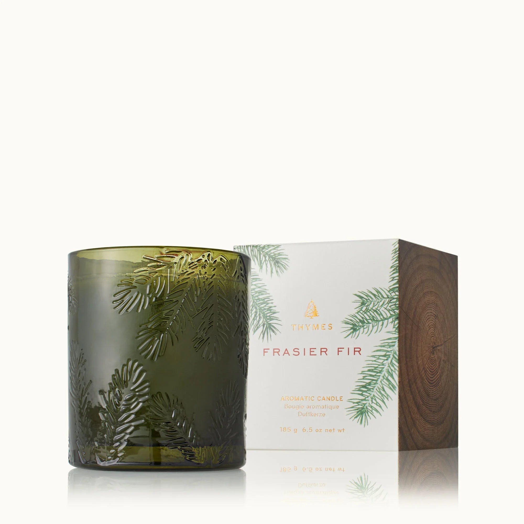 Thymes Frasier Fir green glass candle with fir branch embossing