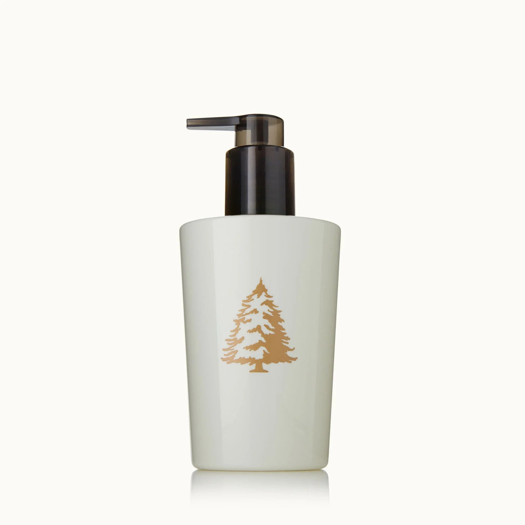 Hand lotion bottle with pump, frosted white with gold pine tree icon
