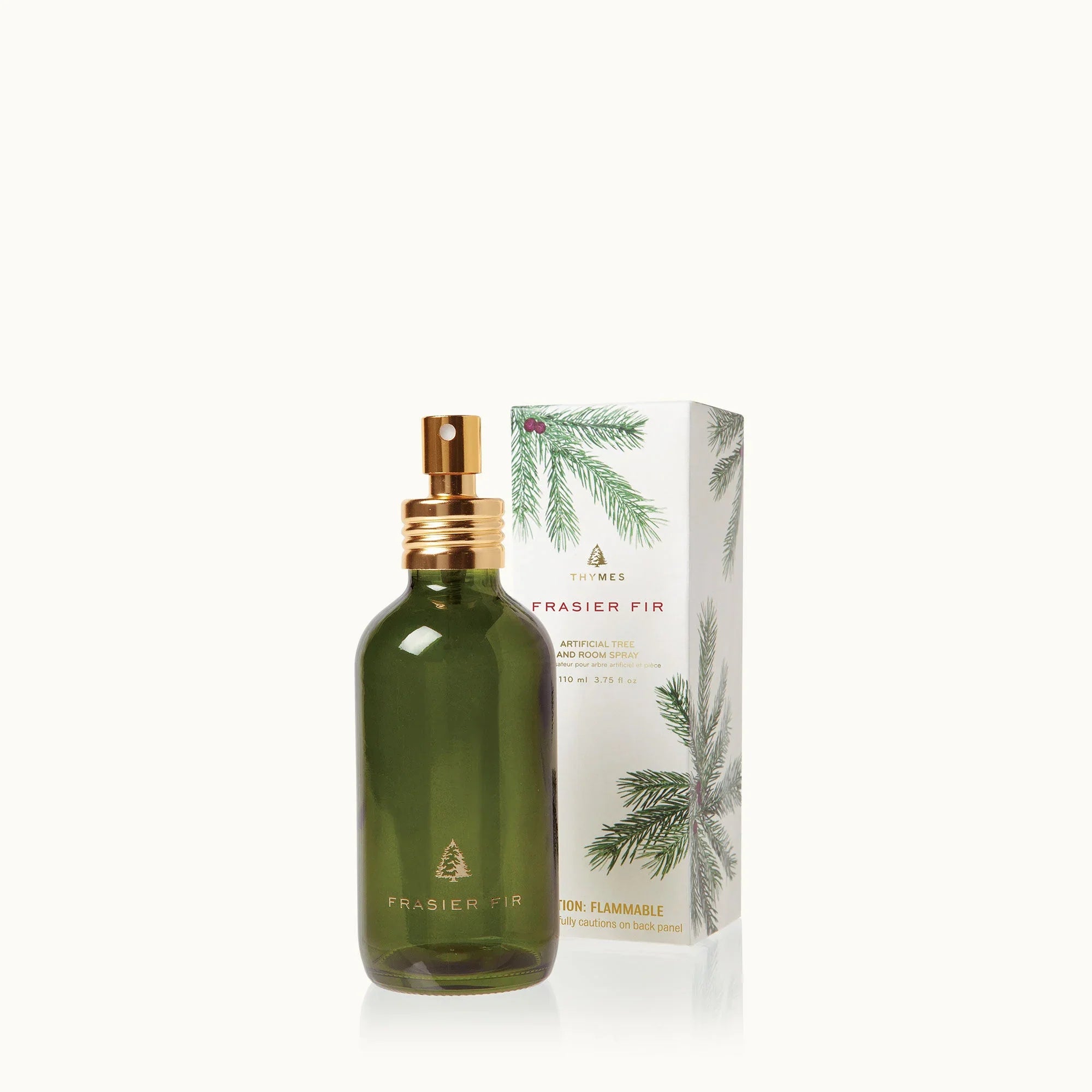 Thymes Frasier Fir room spray bottle with green glass and gold spray cap