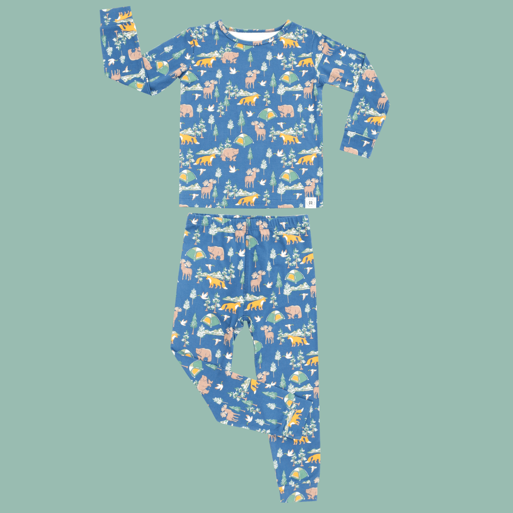 Kids' pajama set flat lay: blue long-sleeve top and matching printed pants