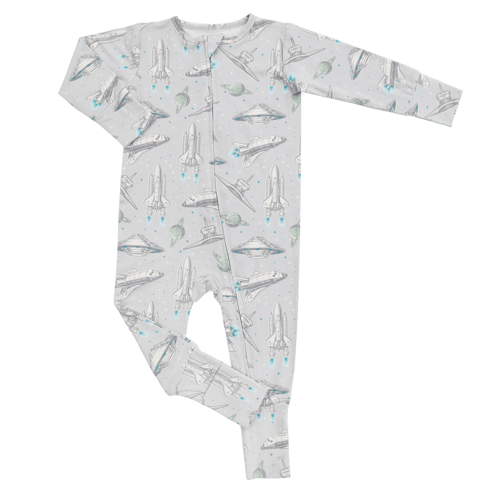 Light gray rocket-print convertible romper with long sleeves and front zipper.