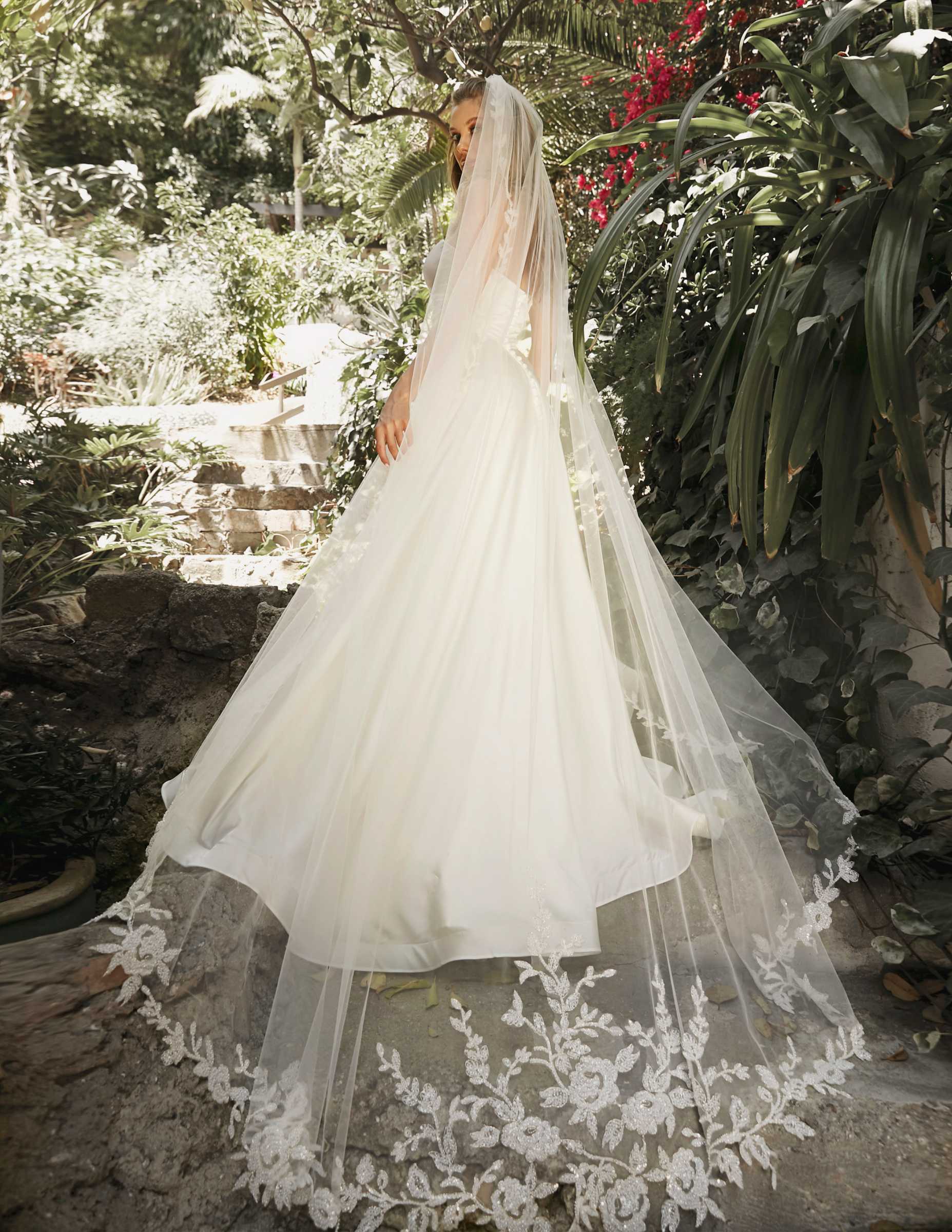 Off-white cathedral veil with beaded floral edge and scalloped lace hem