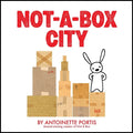 Hardcover book with white cover, red title, box city illustration and bunny figure