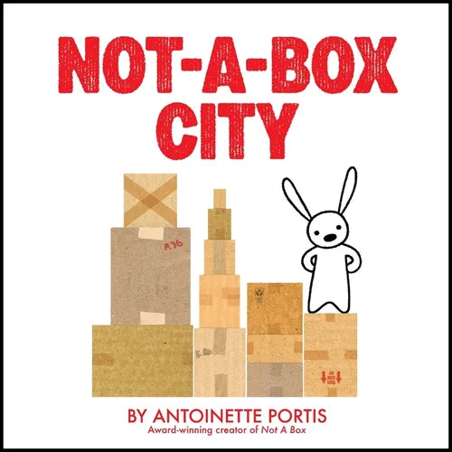 Hardcover book with white cover, red title, box city illustration and bunny figure