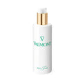 White cosmetic bottle with gold pump and teal-accent label, cylindrical shape