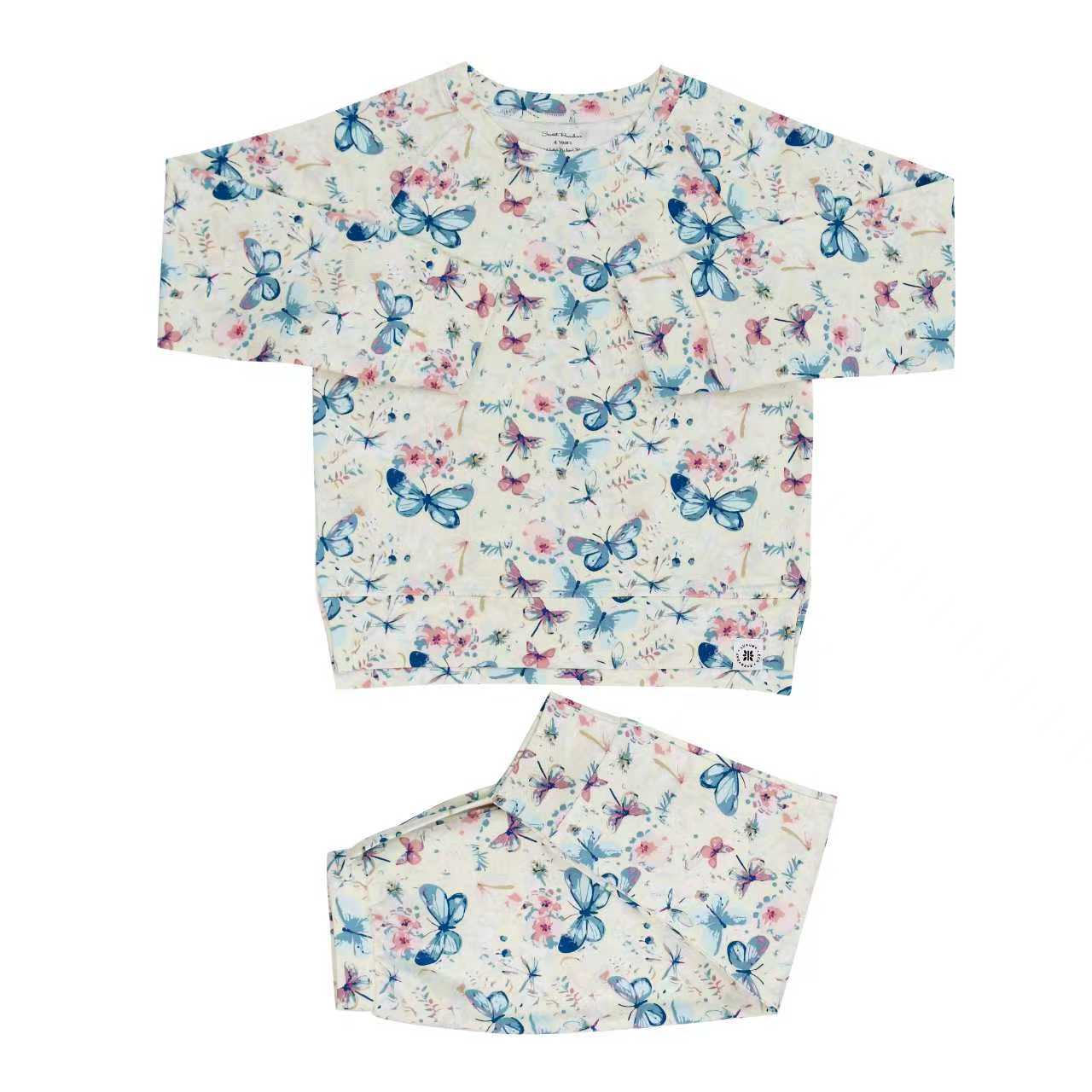 Floral print crew neck top and jogger pants set on light base with blue butterfly designs
