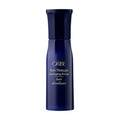 Detangling primer bottle, dark blue with ORIBE text and black cap