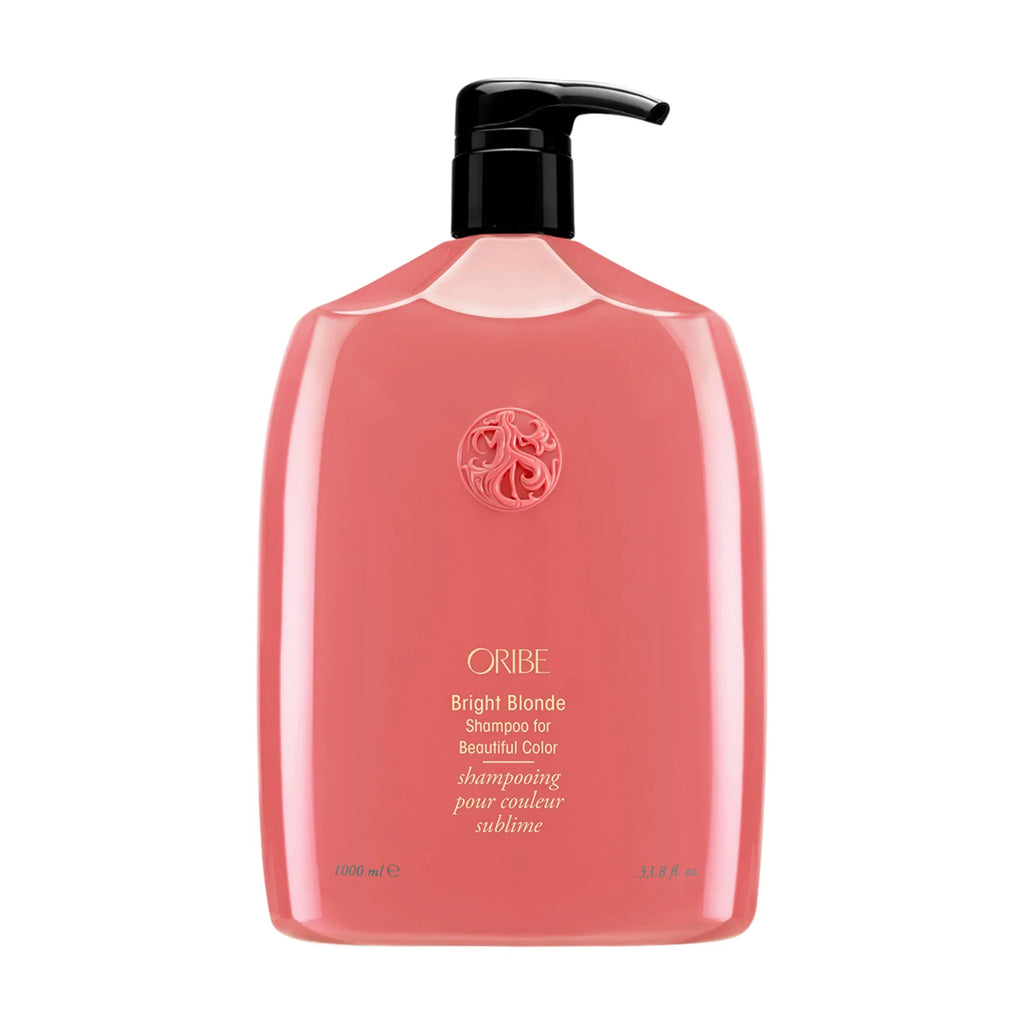 Oribe Bright Blonde shampoo with black pump, red-pink bottle and front logo