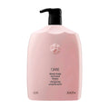 Oribe Serene Scalp anti-dandruff shampoo bottle with black pump, pale pink